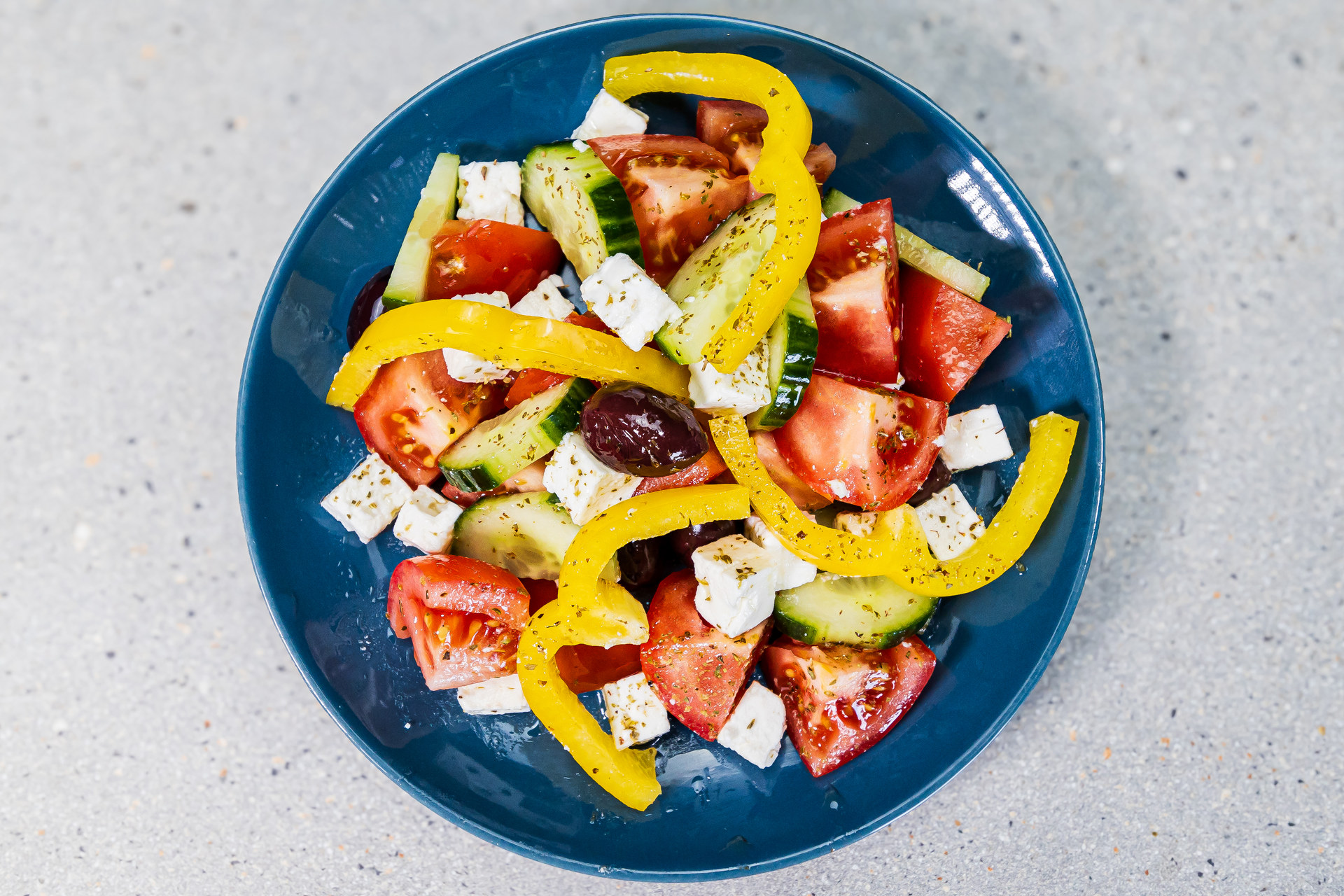 Authentic Greek salad with tomatoes, cucumber, feta cheese, kalamata olives, extra virgin olive oil and oregano - Cristinas Greek Souvlaki Daventry